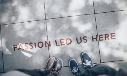 'passion led us here' on sidewalk